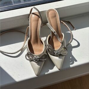 Elegant Ivory Pointed-Toe Slingback Heels with Crystal Bow